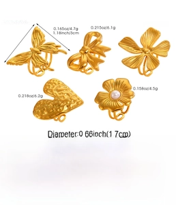 Detailed view of assorted 1.7cm golden stainless steel rings with floral and heart shapes