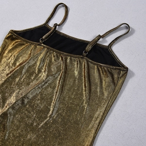 Close-up of gold metallic camisole showing shimmering fabric texture and slim straps