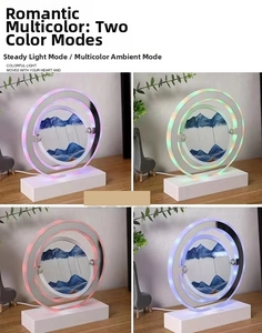 Detail of round moving sand art LED lamp with dynamic blue landscape and RGB lighting