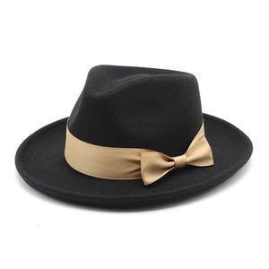 Classic black wool fedora with champagne gold ribbon bow and structured wide brim