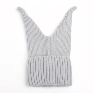 Close-up of light gray knit winter hat featuring soft ribbed texture and unique pointed ears