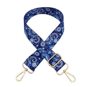 Close-up of blue paisley floral strap with gold metal hooks and adjustable buckle