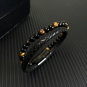 Men's woven leather bracelet with red tiger eye beads and black magnetic clasp