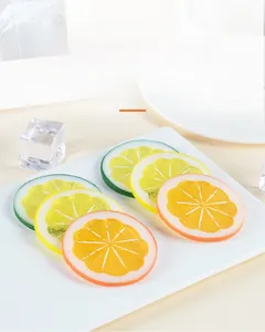 Realistic PVC lemon slice models in yellow, green and orange on white tray with ice cubes
