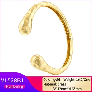 Vintage 18K gold plated brass bangle featuring a unique hammered texture and open design