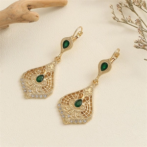 Vintage gold hollow waterdrop earrings with emerald green stones and white rhinestones