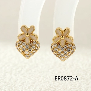 Detailed close-up of heart-shaped clover earrings with white zircon pavé and gold plating