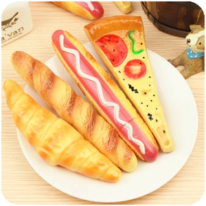 Creative realistic pizza hotdog and bread shaped ballpoint pens on a white plate