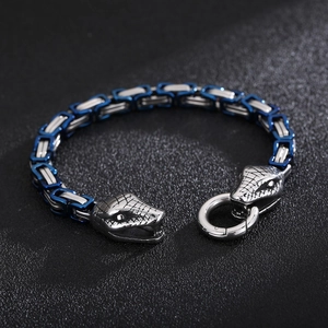 Macro shot of silver and blue Byzantine chain bracelet featuring detailed snake head clasps