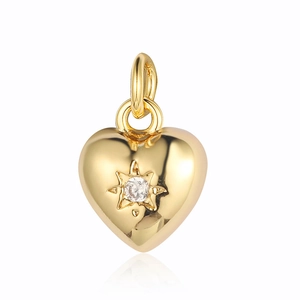 Minimalist gold heart pendant with engraved star and cubic zirconia sparkling detail