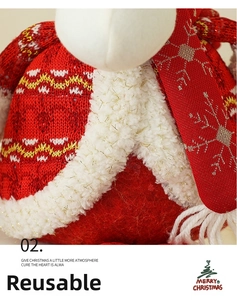 Detail of red knitted Christmas gnome sweater with white faux fur and gold snowflake scarf