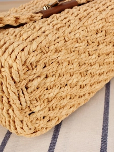 French vintage woven straw crossbody bag with leather buckle and metal hardware details