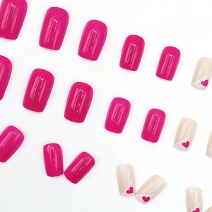 Pink French heart press-on nails in medium square shape with glossy mirror finish