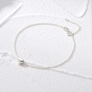 Polished silver heart pendant on a delicate chain with adjustable clasp and extender