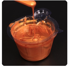 Macro detail of high-viscosity pearlescent orange-gold liquid with a metallic luster