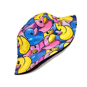 Trendy reversible bucket hat featuring a colorful rubber duck graffiti print pattern