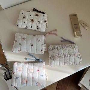 Minimalist quilted fabric coin pouches with cute cartoon animal patterns and zippers
