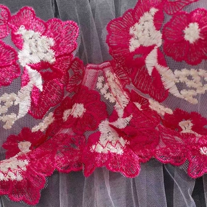 Close-up of pink floral embroidery and breathable grey mesh lace on bra set