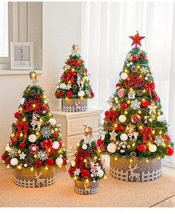 Detailed view of four mini decorated Christmas trees with warm LED lights and felt bases