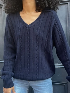 Women's dark blue V-neck cable knit sweater with long sleeves in a casual fit