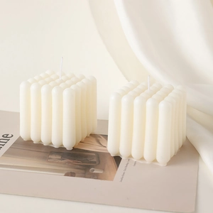 Minimalist cream white geometric bubble candle set on a fashion magazine background