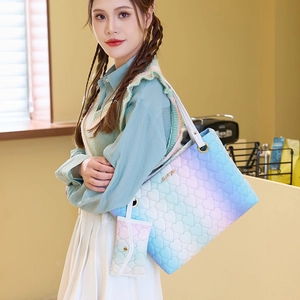 Rainbow gradient quilted tote bag with matching pouch shown on a shoulder in daily setting