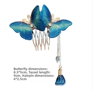 Detailed view of blue butterfly hair comb with silk embroidery and long tassel charm