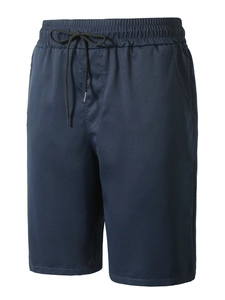 Detailed front view of navy blue cotton twill shorts with black elastic drawstring waist