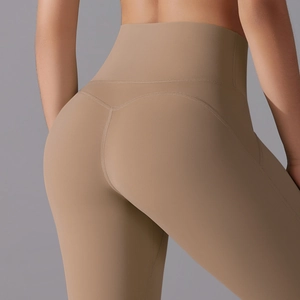 Detailed back view of high-waisted khaki yoga pants highlighting the peach butt-lift seam