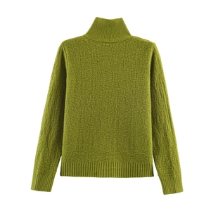 Detail of moss green knit sweater showing rich texture and ribbed high collar