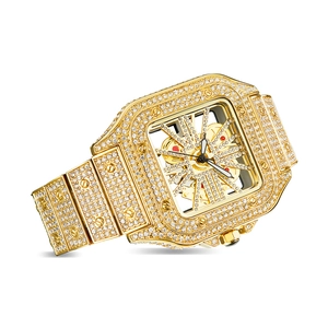 Macro detail of gold luxury iced-out watch featuring skeleton dial and diamond bezel