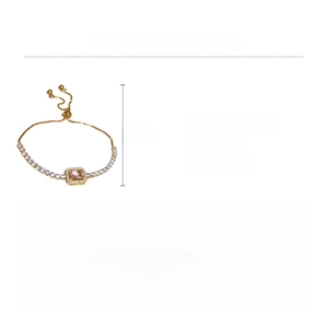 Detail of adjustable golden copper bracelet with pink zircon stone and size dimensions