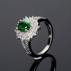 Exquisite S925 silver ring with oval emerald-green zircon and flower-shaped crystal halo