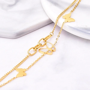 Double-layered 18k gold plated titanium butterfly bracelet with white shell inlays