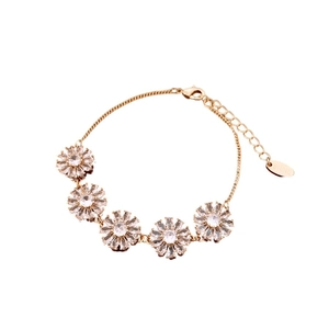 Exquisite gold-plated floral bracelet featuring marquise zirconia petals and SHINE tag