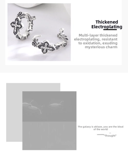Close-up of S925 sterling silver cross earrings with white diamonds and vintage engravings