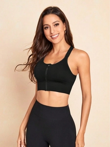 Detail view of black sports bra with front zipper and thin straps for high support