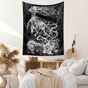 Detail of gothic tapestry featuring surreal skull and withered tree design in bedroom