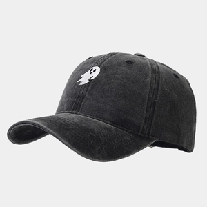Detailed view of white ghost embroidery on vintage dark grey washed cotton baseball cap