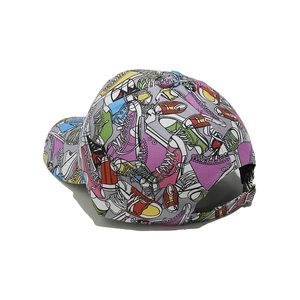 Detail view of colorful sneaker graffiti print and adjustable metal buckle on baseball cap