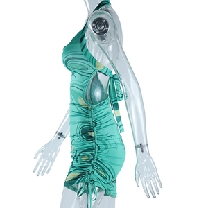 Detail view of green marble print dress with side drawstring and ruched texture