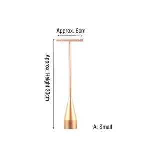 Detailed view of small T-shaped rose gold metal earring stand with dimensions 6x20cm