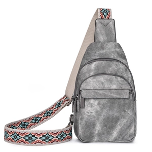 Gray washed denim chest bag with vintage texture and ethnic pattern shoulder strap