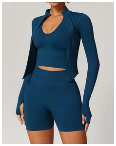 Détails du haut de yoga côtelé bleu paon avec passe-pouces et tissu extensible sans couture