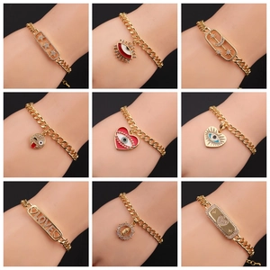 Detail of nine gold-plated chain bracelets with zircon moon and eye charms on a bust