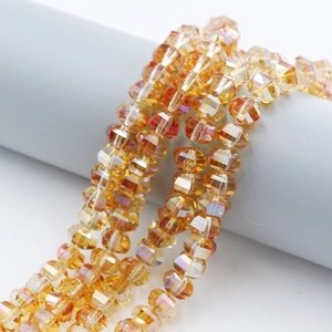 Macro shot of 8mm amber gold faceted crystal beads with AB coating for jewelry making