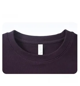 Detail of crewneck collar with washing label and size sticker on purple fleece sweatshirt
