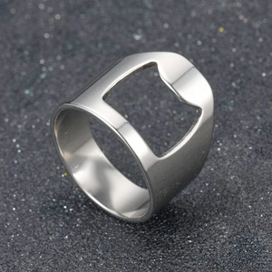 Macro shot of silver stainless steel bottle opener ring with square opening detail