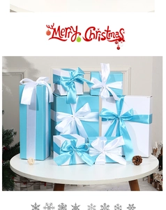 Macro view of Tiffany blue and white Christmas gift boxes with satin ribbon bows