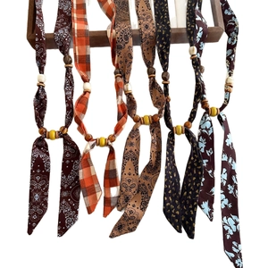 Bohemian chiffon necklace with fabric floral prints and decorative wooden beads